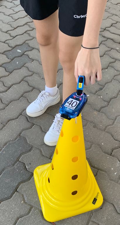 A student tap an electronic checkpoint with electronic key