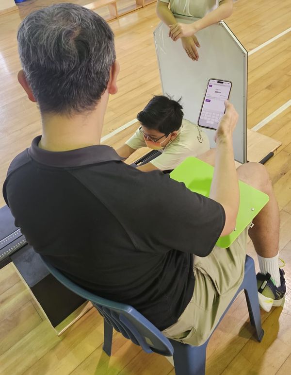 A PE teacher is recording result
